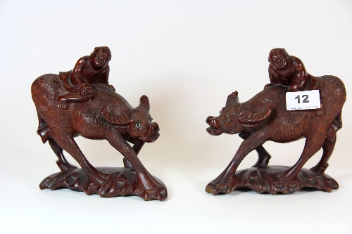 A pair of carved eastern hardwood figures of water buffalo 17cm, and folding Victorian pine stool.