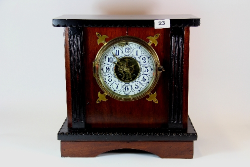 A 19thC mahogany and ebonized mantle clock. H.36cm W.36cm