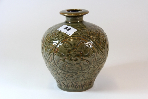 A Chinese Yuan style incised and celadon glazed pottery vase probably 19th or early 20thC H.16