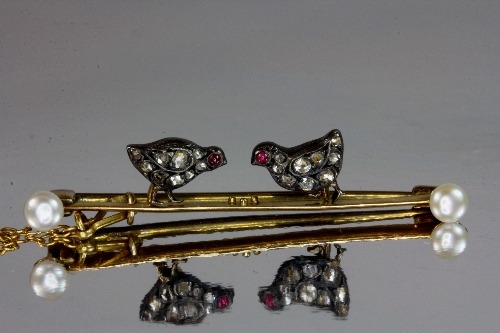 An Edwardian yellow metal ( tested minimum 9ct gold) tie pin/ bar brooch set with diamonds, cultured