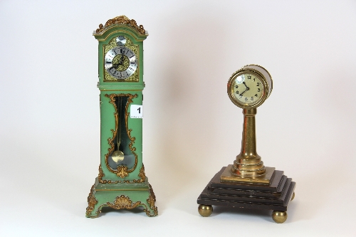 A painted miniature long case clock H.30cm and a further victorian brass clock.