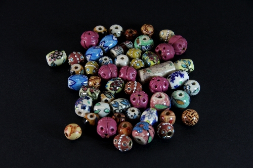 A bag of vintage ceramic and other beads.