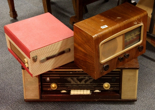 Two vintage radios and a portable Dansette record player.