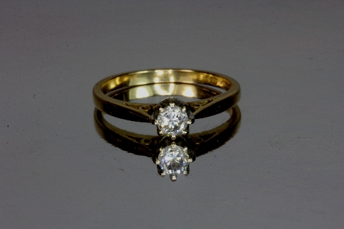 An 18ct yellow gold diamond solitaire ring. Size N