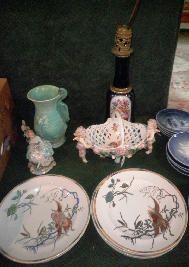 A part-set of seven Royal Worcester 27cm diameter plates, each decorated with a crane-type bird in a