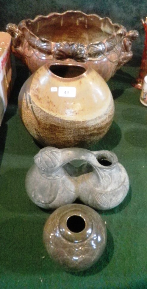 Four pieces of studio pottery, including an Art Nouveau jardiniere with twin figural handles, a vase