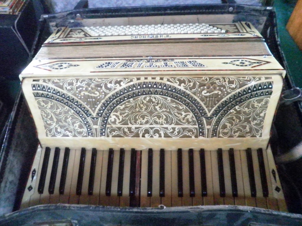 A Settimo Soprani 120 key piano accordion, cased.