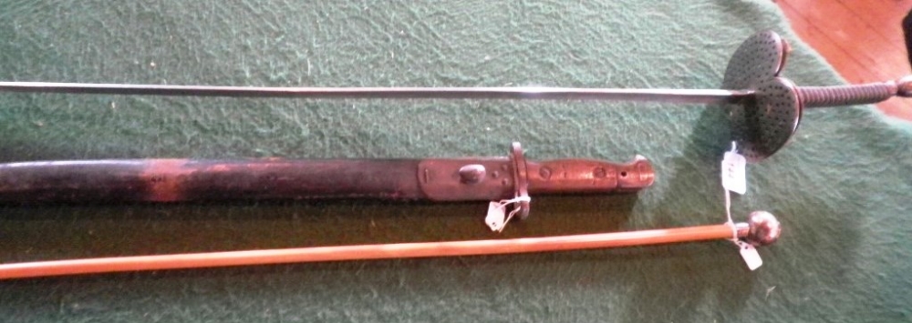 A silver mounted Yorks & Lancaster Regiment swagger stick, an Edwardian English bayonet in leather
