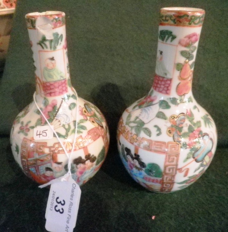 A pair of early/mid-twentieth century Cantonese squat vases, each of bottle shape, typically