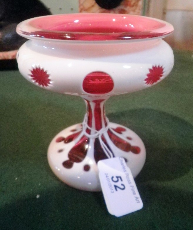An early/mid-twentieth century Bohemian white opaque and cranberry glass pedestal sweet meat dish,