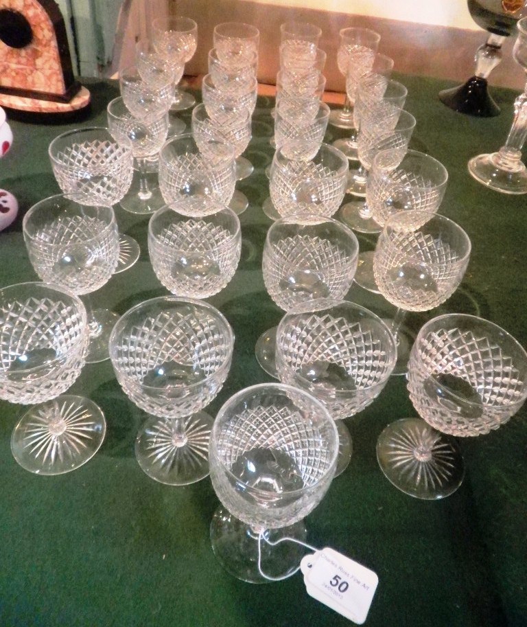 A suite of Edinburgh and Leith cut wine glasses (24), together with five similar glasses.