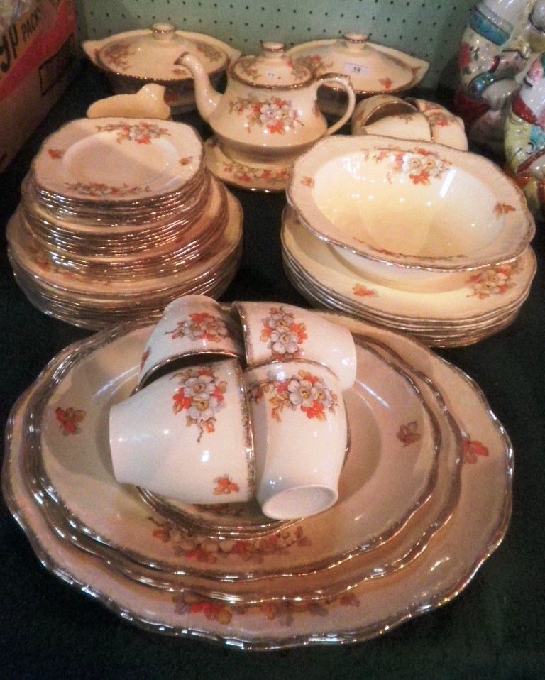 An Alfred Meakin Marigold dinner and tea service, largely an eight place setting.