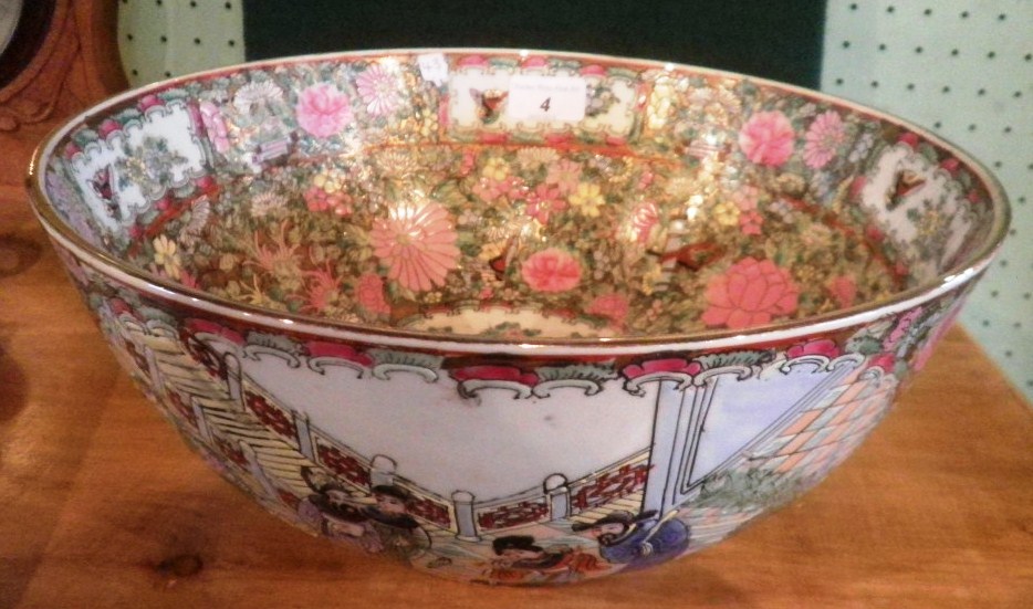 A contemporary Chinese porcelain bowl, typically decorated with figures, flora and fauna in the