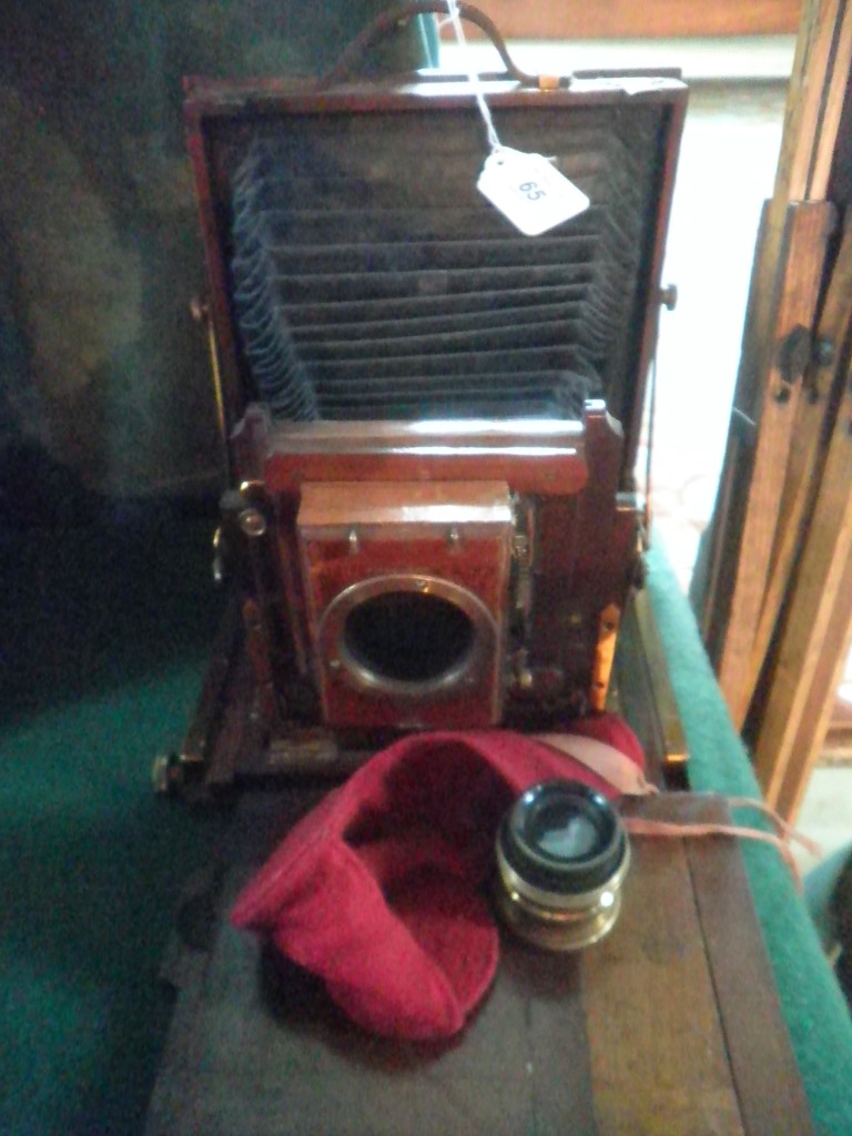 A National Camera Company, mahogany cased plate camera, together with a Beck Symmetrical Lens and an