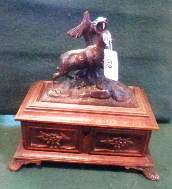 A late 19th/early 20th century French oak musical jewellery box, the hinged lid with tree and goat