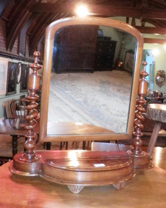 A Victorian mahogany toilet mirror, having rectangular plate within barley-twist horns, on a bow