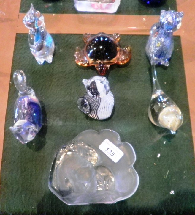 Seven glass paperweights, variously fashioned as cats, turtle and other animals.