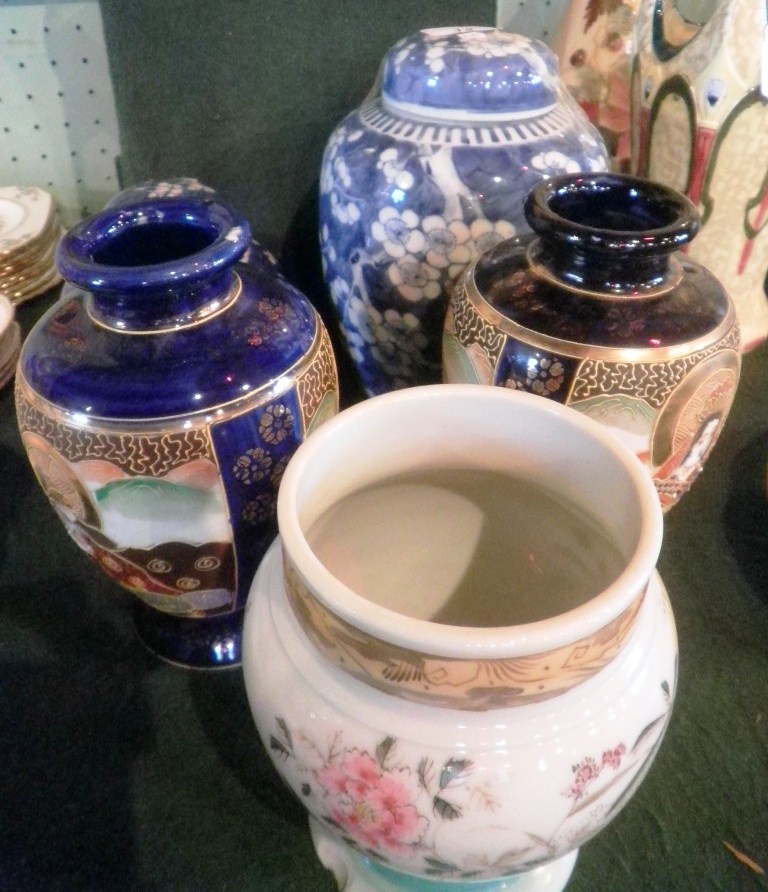 Two covered ginger jars, each decorated with hawthorn, together with a pair of mid- twentieth