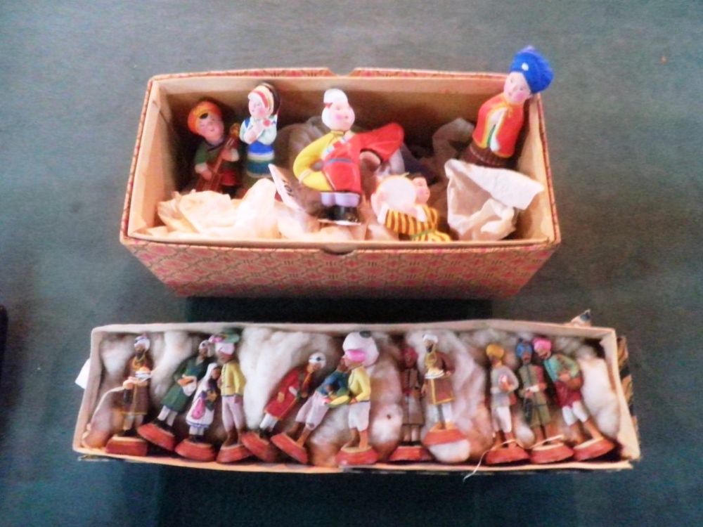 A boxed set of Indian clay figures representative of everyday life, together with a similar set of