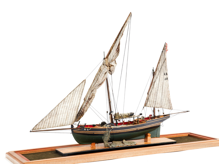 A SCALE MODEL OF A MEDITERRANEAN FISHING BOAT, the carved hull with planked deck complete with