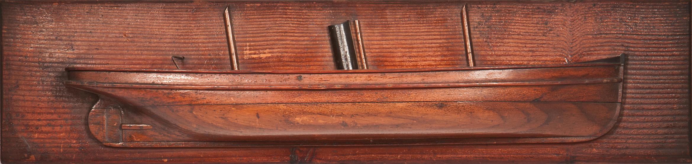 AN ATTRACTIVE LATE 19TH-CENTURY HALF-BLOCK MODEL OF A COASTER, with laminated and carved hull, cut-