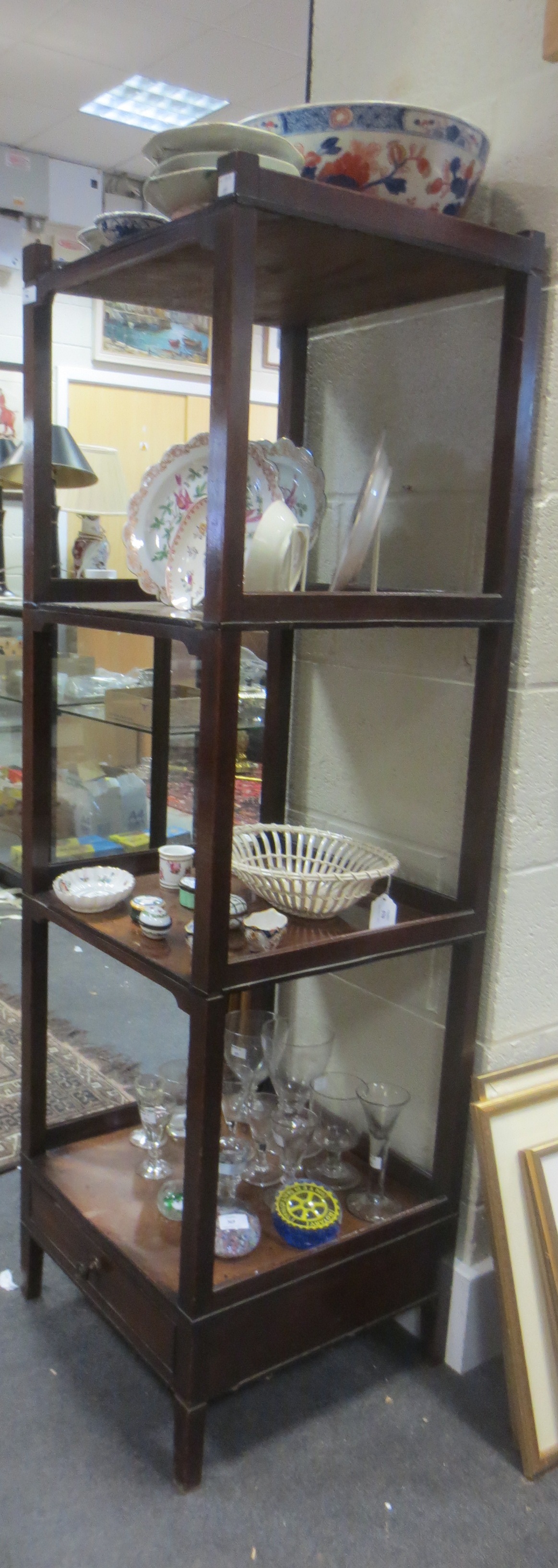 A George IV mahogany four tier etagere with drawer base, 142 x 43 x 43cm A George IV mahogany four