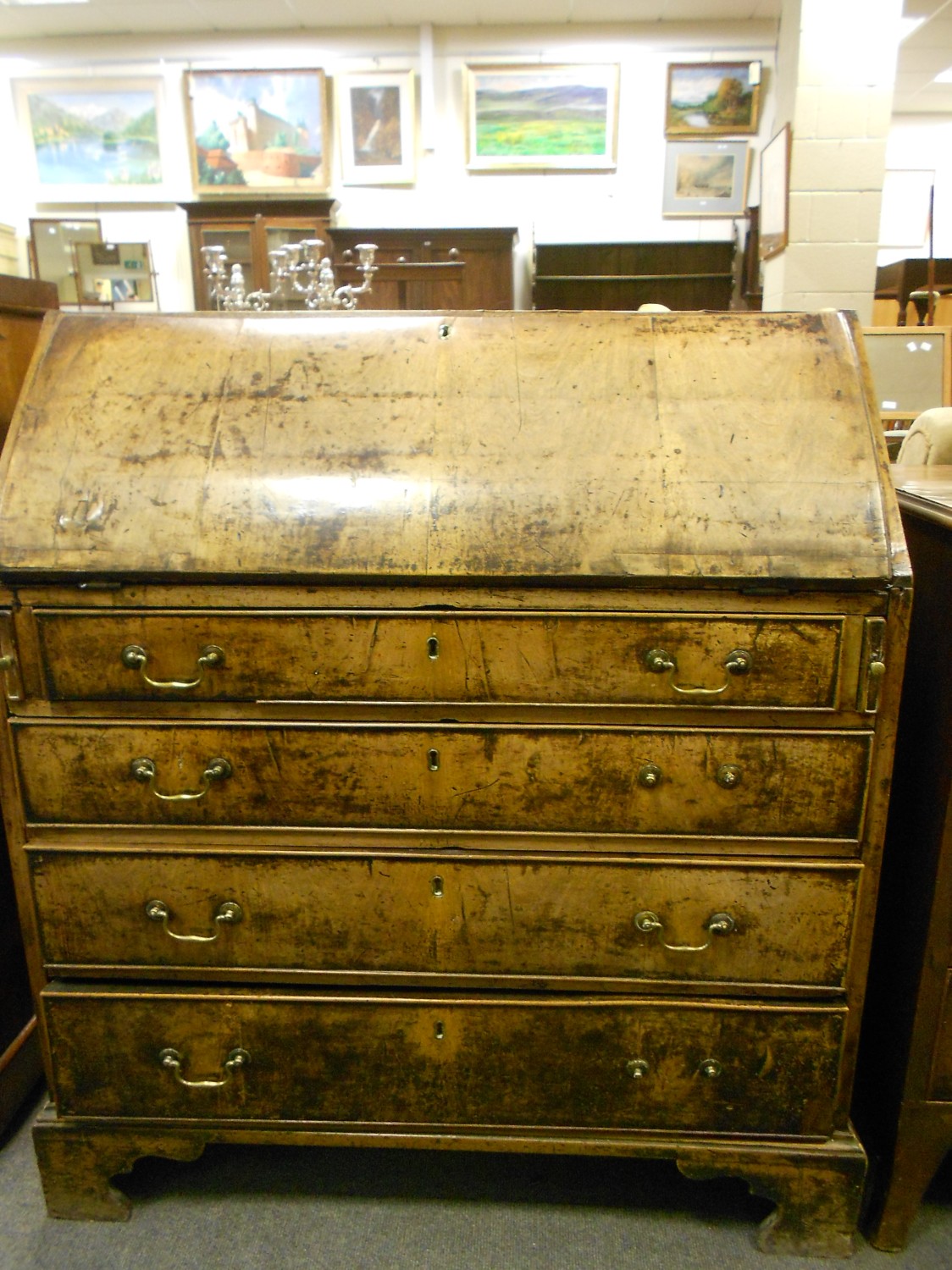 An 18th Century walnut bureau with fall front, on bracket feet 106cm high x 94cm wide