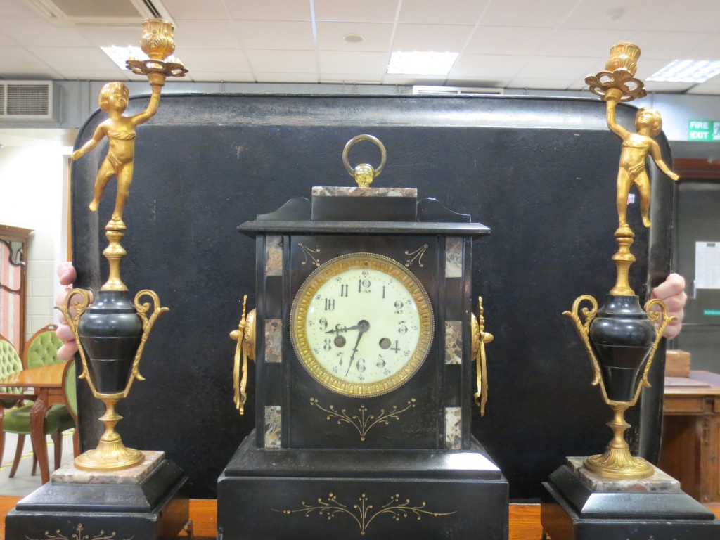A 19th Century French marble cased mantle clock garniture by S. Marti and urns