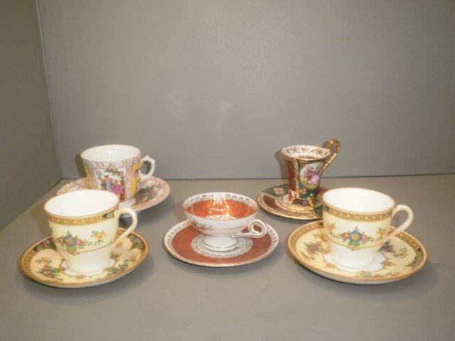 An assortment of five cabinet cups and saucers including Minton and Dresden.