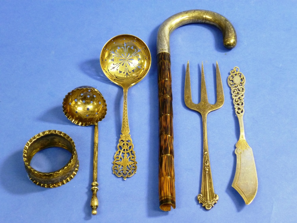 A small quantity of silver items, including a sifter spoon, a straining spoon, butter knife,