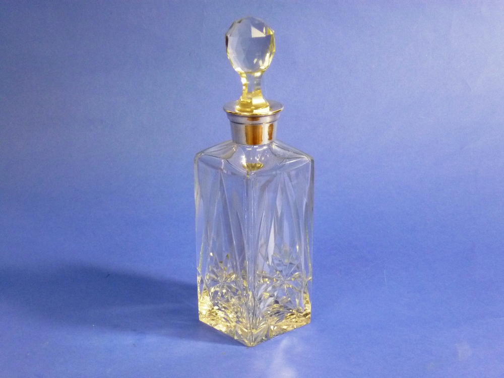 A silver-mounted cut-glass Decanter, cut with stars and facets, with associated stopper, 10½in (26.