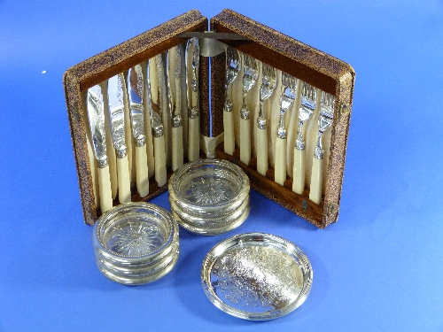 A set of six cut glass and silver-plated table coasters, together with two small silver plated trays