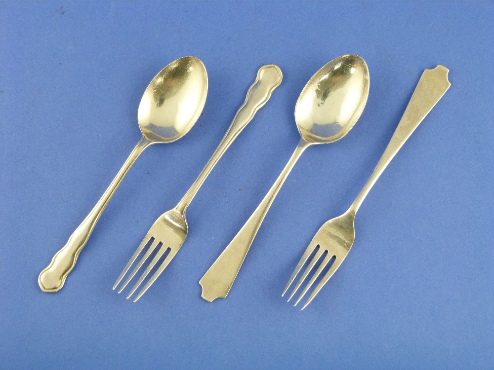 A silver child`s Spoon and Fork set, hallmarked Sheffield, 1929, 5½in (14cm) long, and another spoon