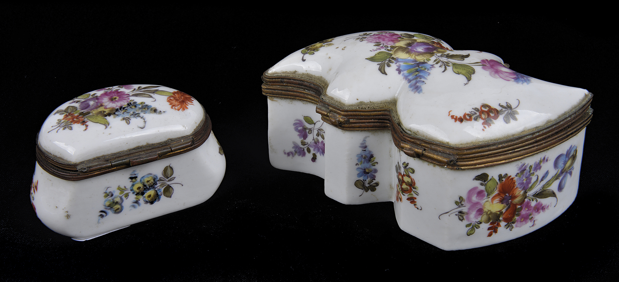 A 19th Century porcelain table box decorated with floral sprays with brass mounts, marked with