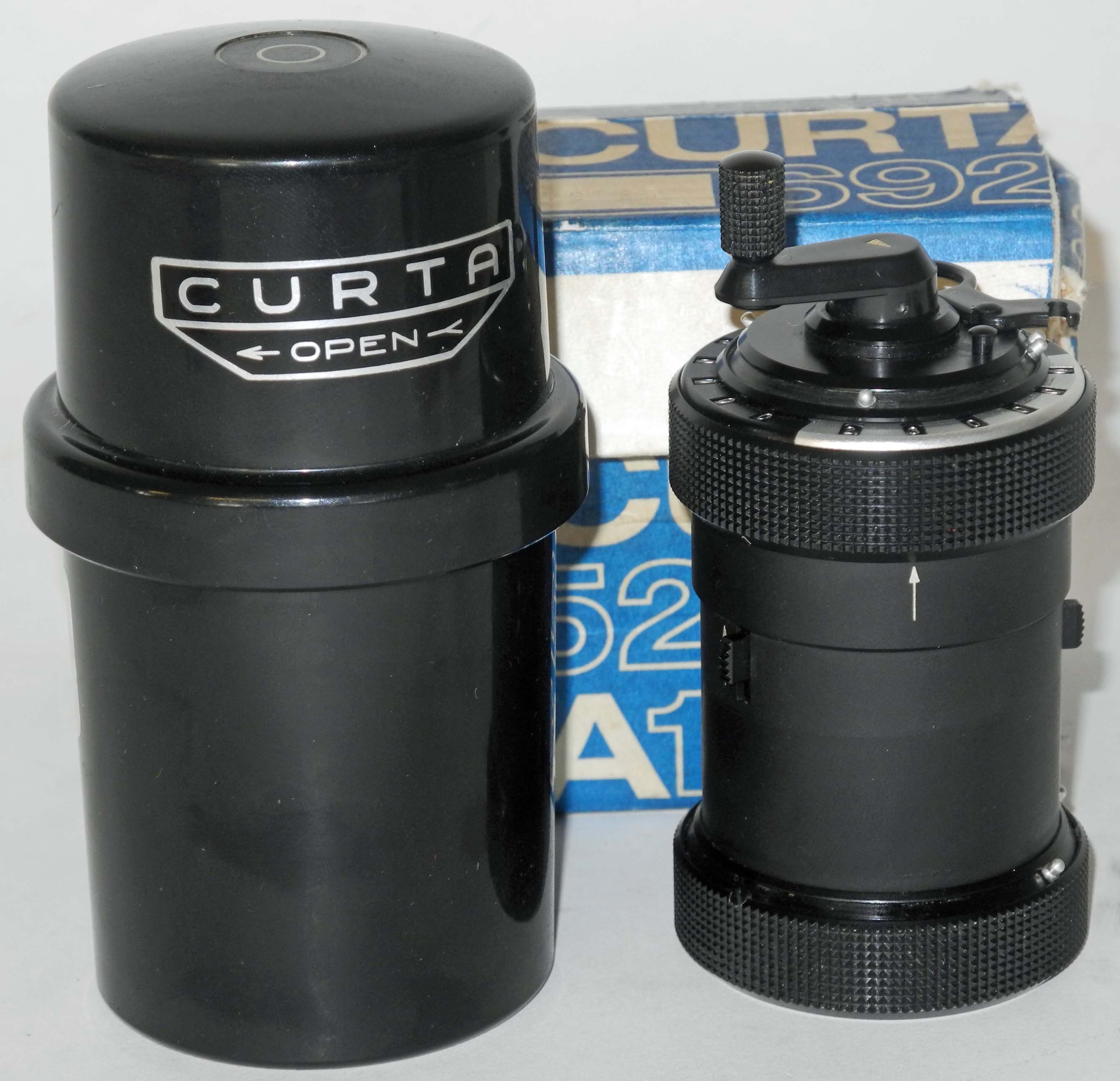 A rare mechanical Curta calculator, complete with protective case, original box and instructions.