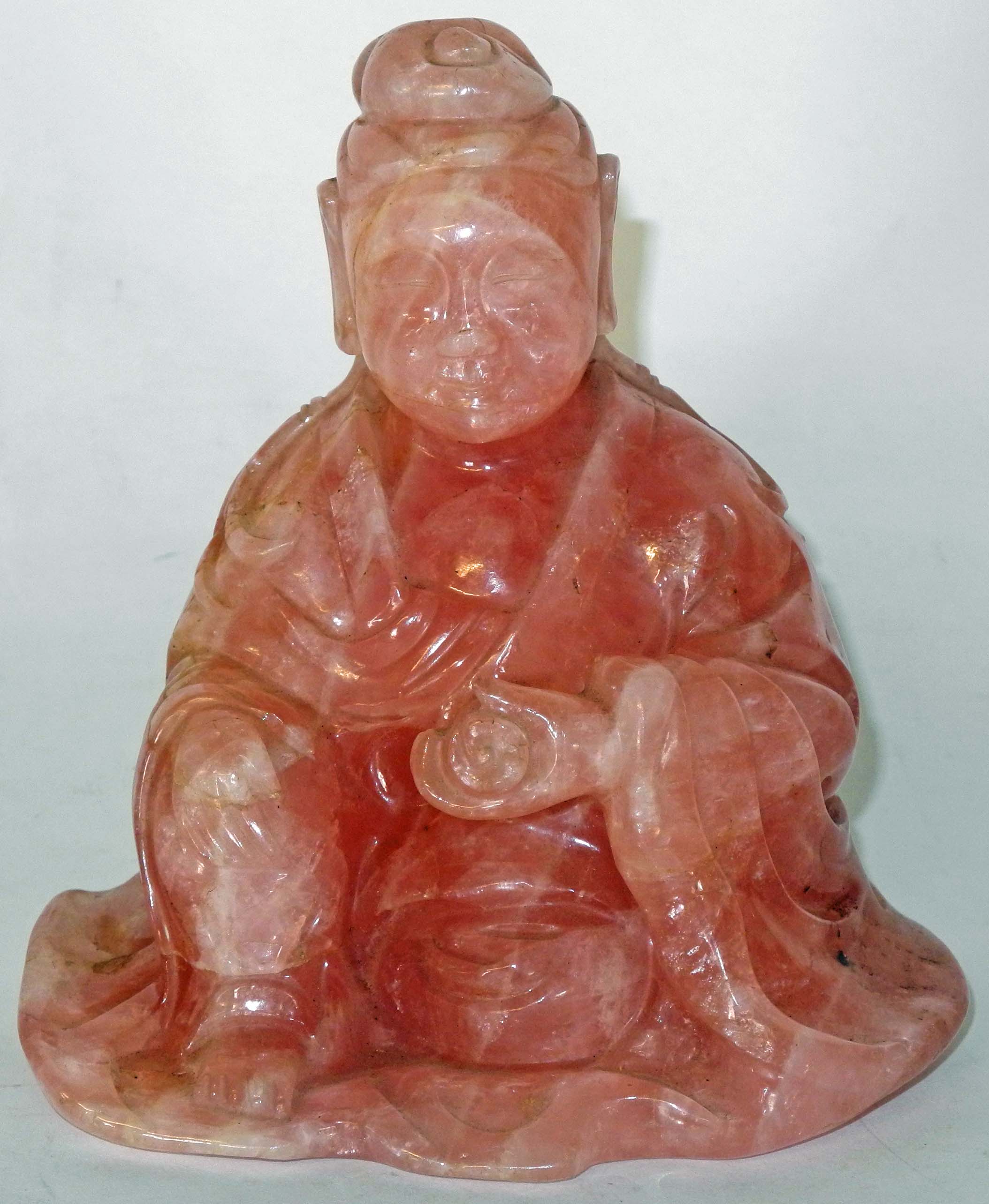 A Chinese rose quartz carved figure of a Buddhistic scholar.15cm high