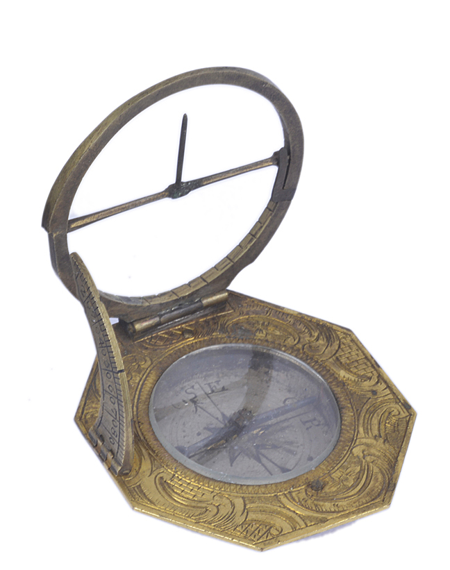 An antique German brass pocket sundial compass, with engraved decoration, the back signed Elev. Pot?