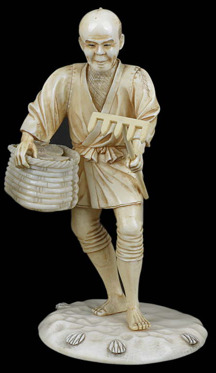 A good antique Japanese ivory okimono of a farmer holding a basket and rake.18cm