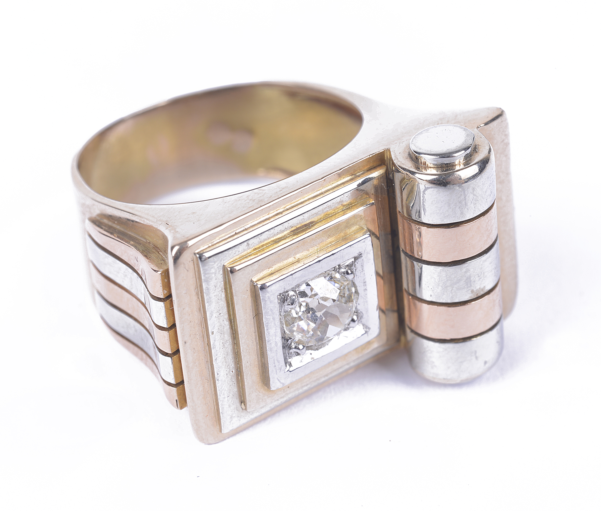 A French 18 carat yellow and rose gold, platinum ring set with a single round brilliant cut