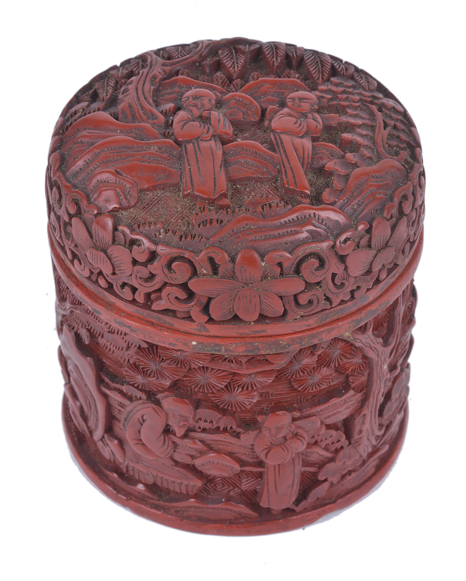 A 19th Century Chinese cinnabar lacquer cylindrical box, with carved decoration. 8.5cm