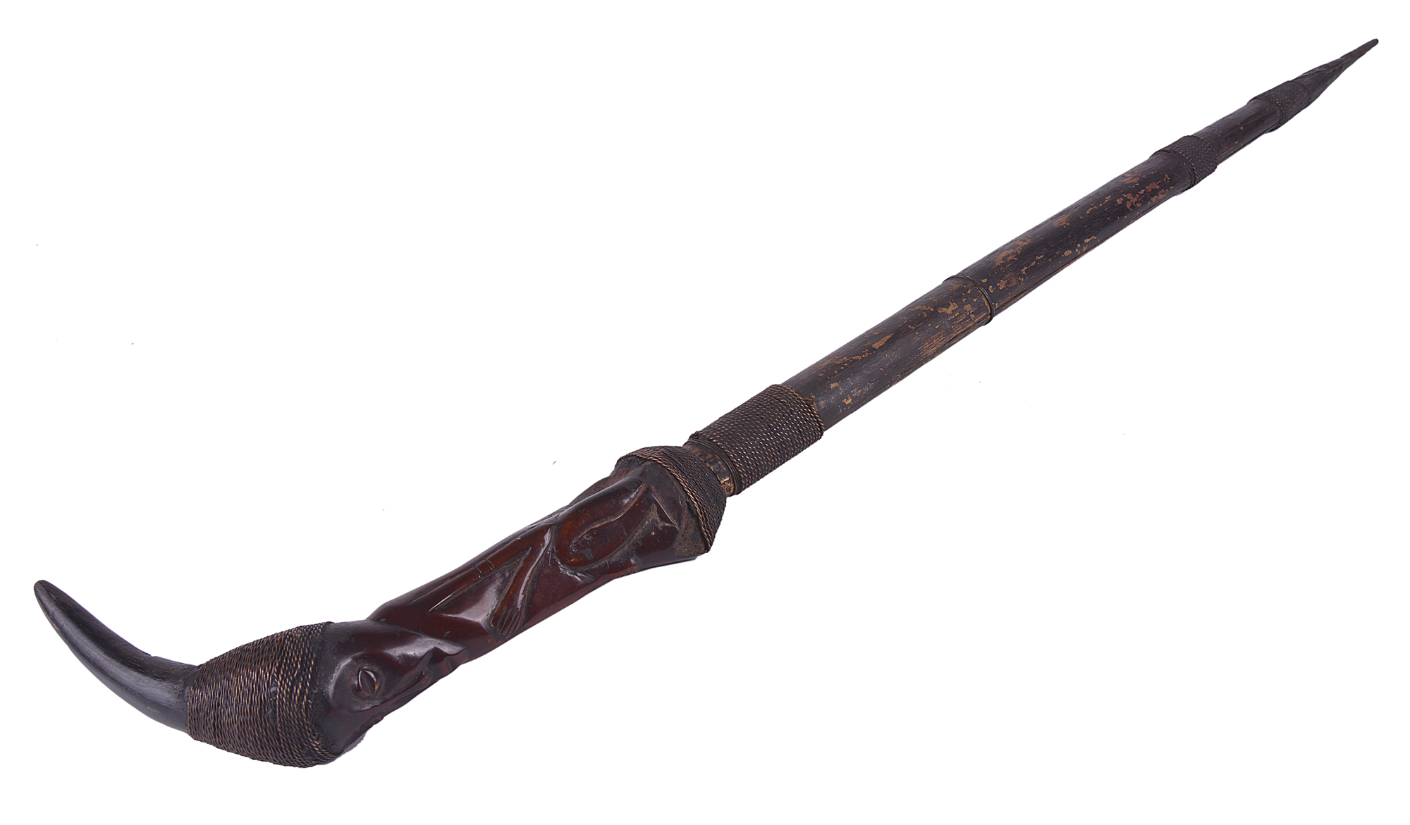 A rare African antique tribal edged weapon with carved horn grip and copper bound scabbard.The