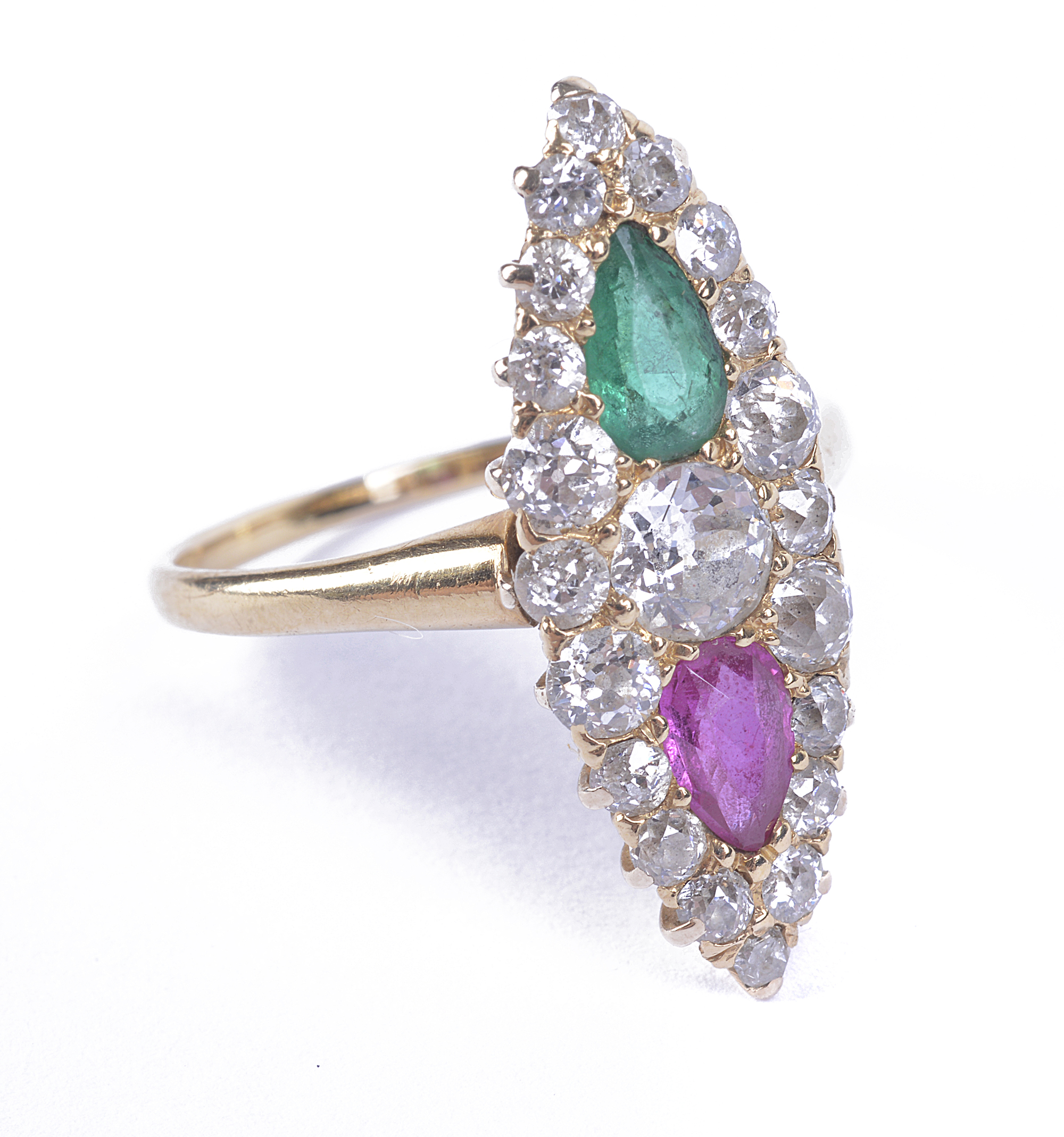 An Edwardian diamond, emerald and ruby marquise shaped ring, pavé set with diamond and a tear shaped