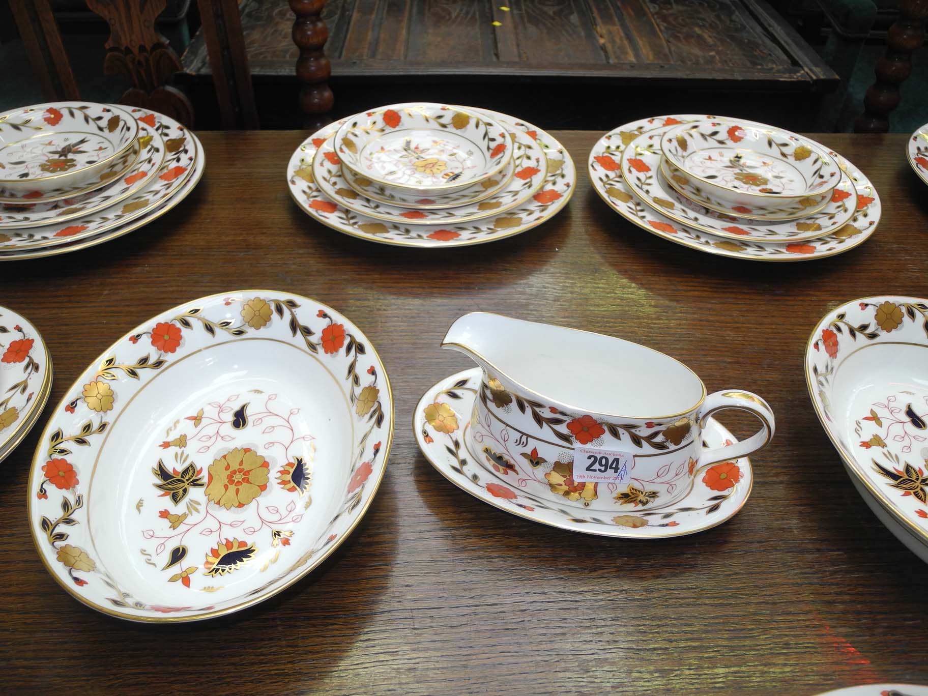 An extensive Royal Crown Derby bone china dinner service in `Asian Rose` pattern (8687),