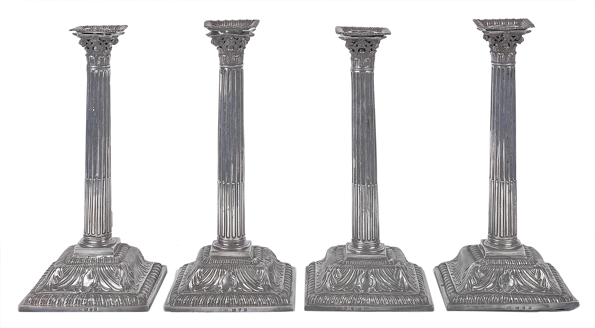 A set of four George III hallmarked silver candlesticks modelled as Corinthian columns on square