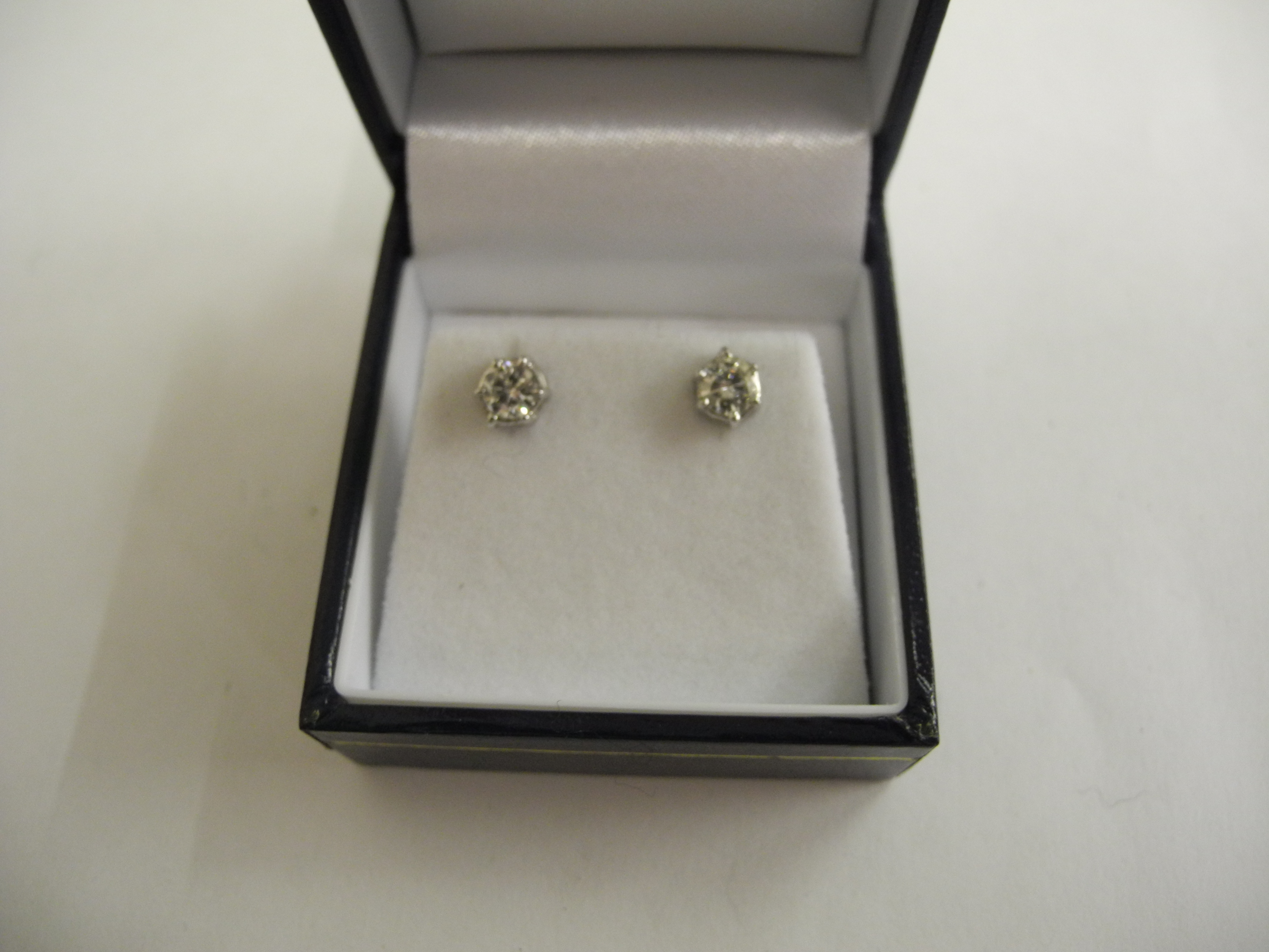 A pair of 18ct white gold and diamond set earrings.