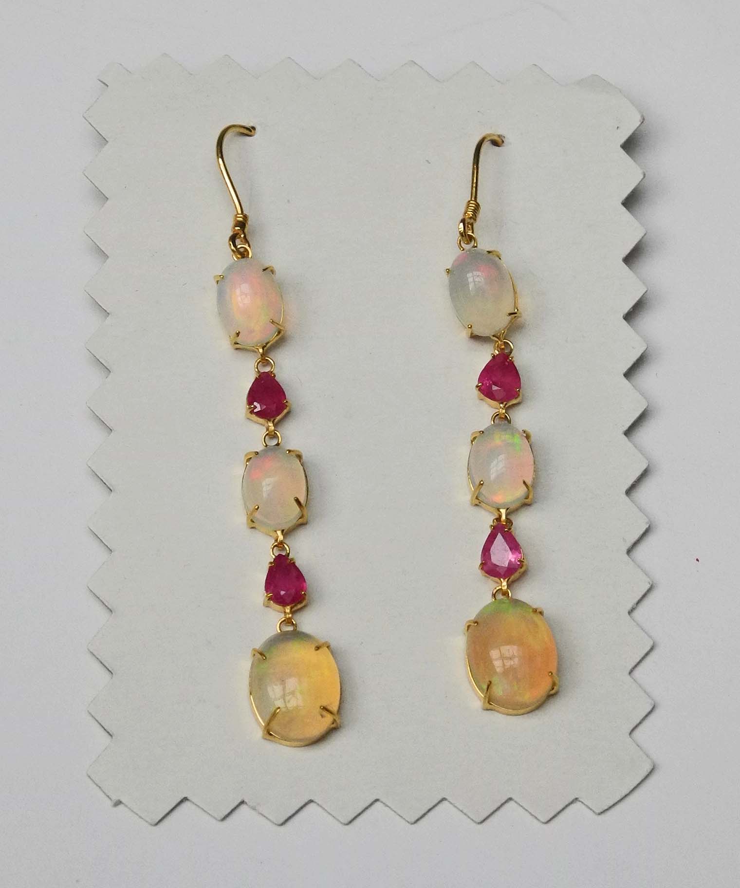 A pair of 14ct gold, opal and ruby drop earrings.