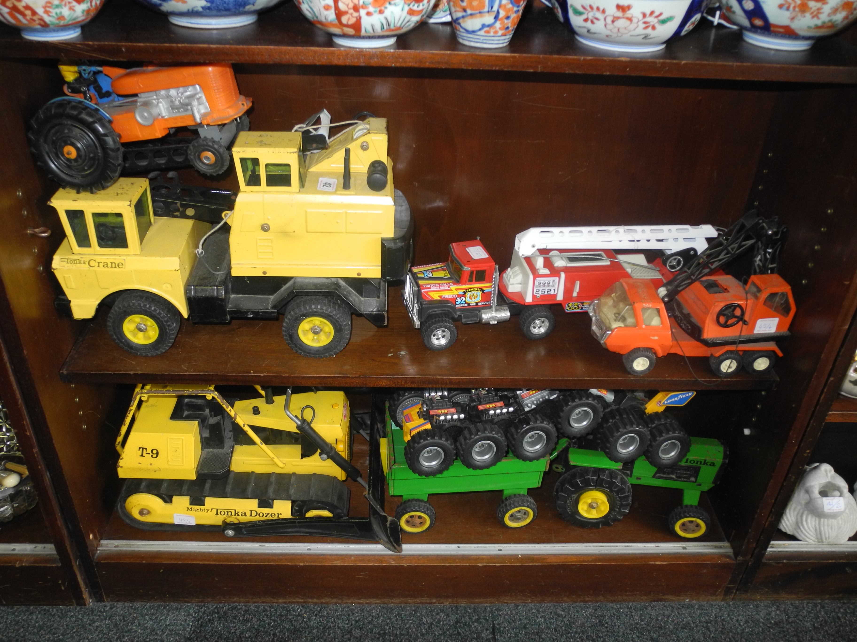 Four large vintage metal Tonka Toys with three more vehicles. (7)