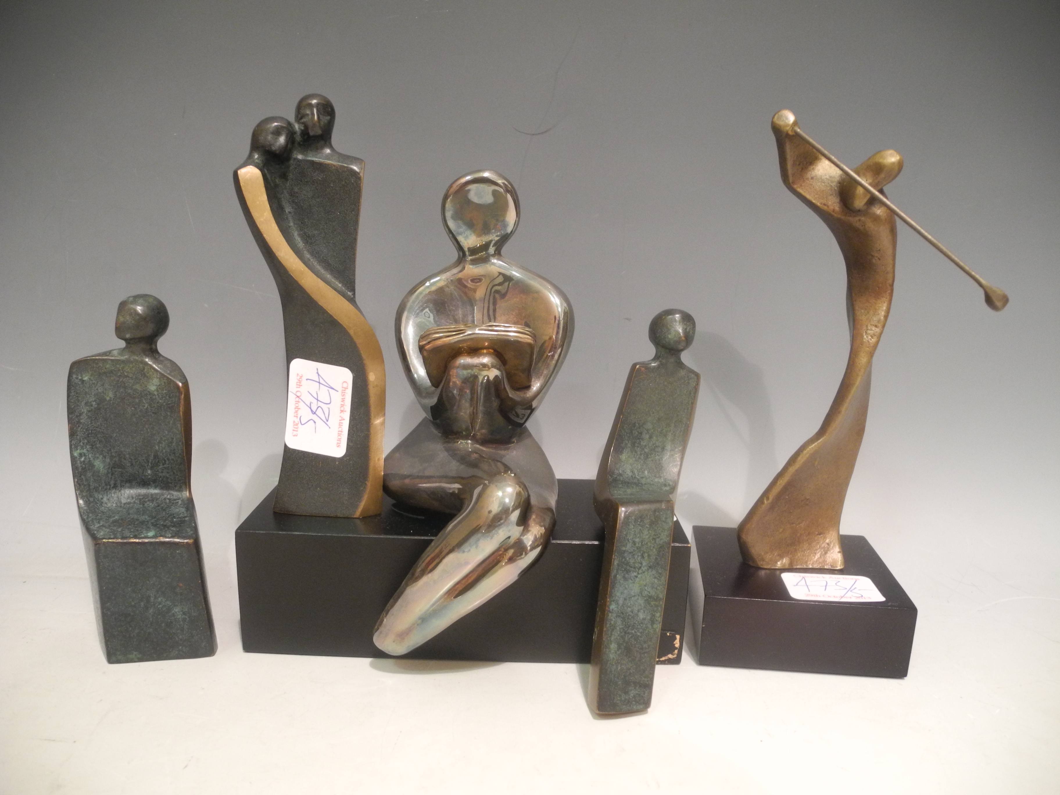 Five sculpture figures including a bronze golfer, and three semi-abstract figures. (5)