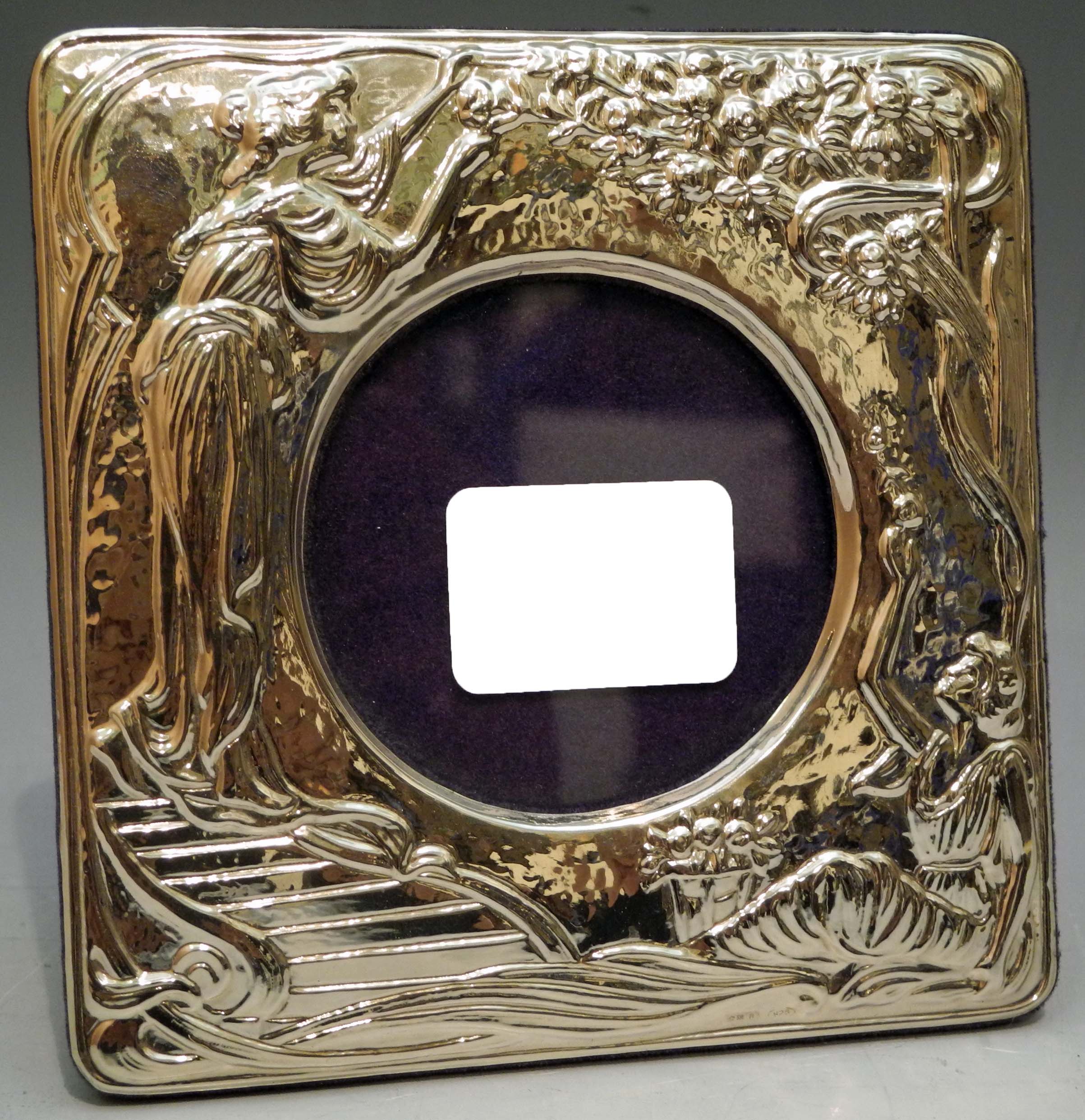 An Italian design sterling grade silver Art Nouveau style photograph frame, embossed with