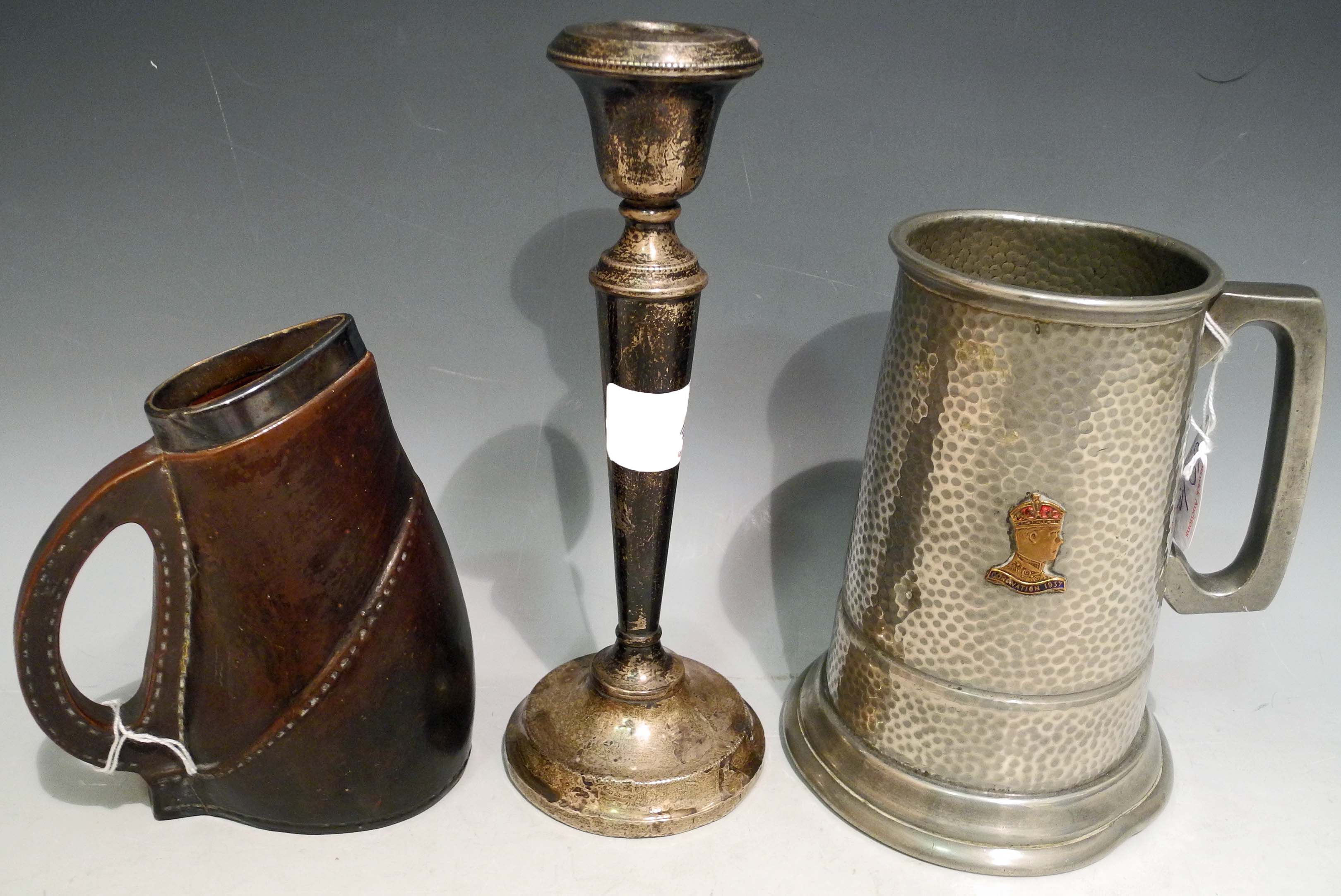 A pottery leather jack jug with hallmarked silver rim, sold together with a white metal single